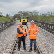 Dr Graham Plant, the GWSR’s civil engineering director (right), formally returns control of Stanway Viaduct to Neil Carr, operations manager