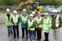 Cllr Margaret Nolder with fellow Cam Parish Council members and Graham Jones, of Snape Construction, left, on the site of the new Cam community building
