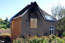 The fire damaged house in Uley Road, Dursley