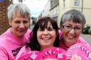 Paint the Town Pink team members Maggie Butterfield, Sue Davies and Megan Parry raising breast cancer awareness in Dursley on Saturday