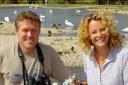 Martin McGill, senior reserve warden at the Slimbridge Wildfowl and Wetlands Trust, with TV presenter Kate Humble and a copy of their book, Watching Waterbirds