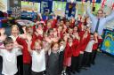Class 1 and 2 with Dursley Primary School head teacher Paul Daniels celebrating the school's recent inspection
