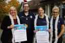 Tracy Docherty, from A Cut Above the Rest and chairwoman of the Cam Traders Association, with Antony Giuliano, community champion at Tesco, Cam and Kerry Hogg and Jay Johnson from the Berry Blue Café – holding up posters for the Cam Christmas lights