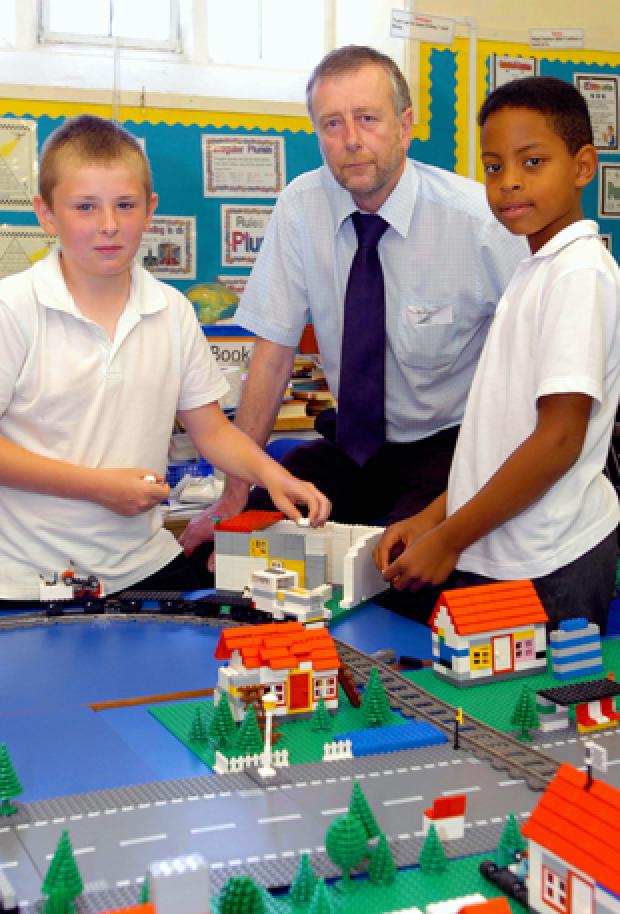 Philip Garside of Team Building Workshops with Tom Nourse, 10, and Adam Menzies, 10, of Horton Primary School during their town planning lego workshop