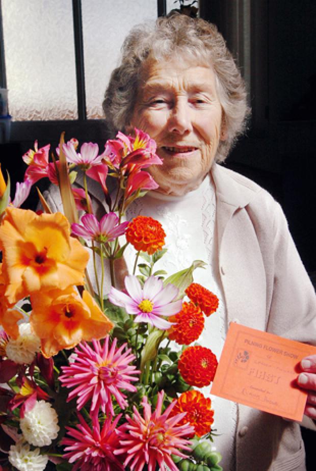 Elaine Hodge with her prize-winning garden flower arrangement at the Pilning Flower Show on Saturday