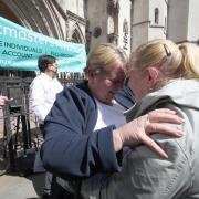 Former post office worker Wendy Buffrey (left), from Cheltenham, is hugged outside the Royal Courts of Justice, London, after having her conviction overturned by the Court of Appeal. Image: PA