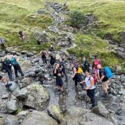 The team on Scafell Pike as they battled the elements to trek the Three Peaks for charity