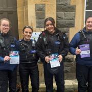 Officers from Avon and Somerset Police with leaflets promoting the Walk and Talk scheme