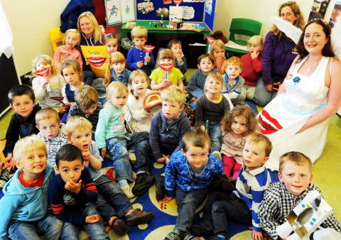 Dentist 'tooth fairy' Gemma Allen with the children at Woodfield Nest during her talk about dental health