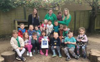 Children and staff from Natural Choice Nurseries Alveston celebrating their new good Ofsted rating