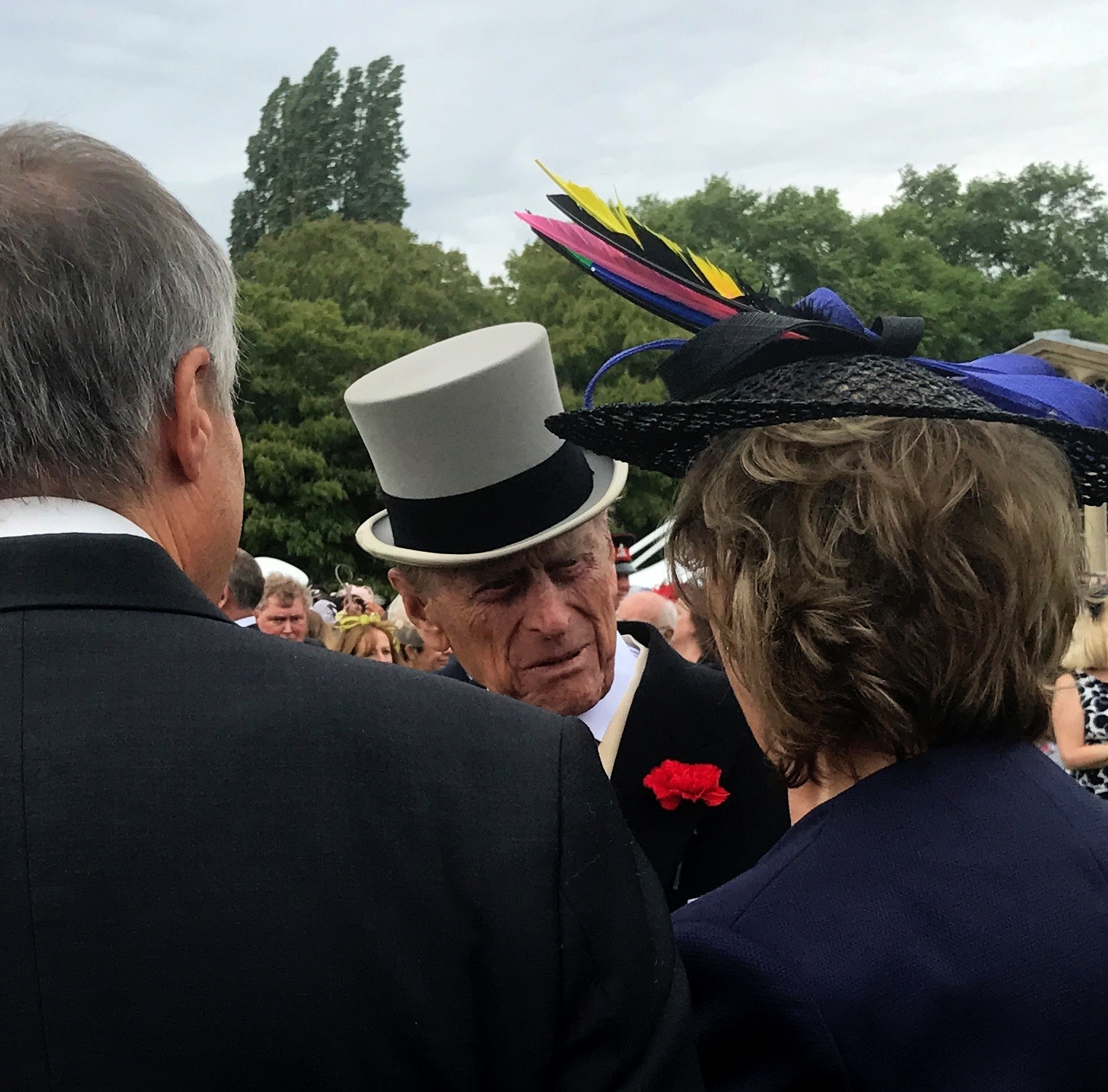 Angus and Fiona Macaskill speaking to Prince Philip at a Buckingham Palace garden party in 2017. Angus has based his painting on this photo 