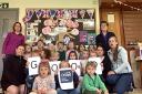 Children and staff from Kingswood Village Playgroup celebrating their 'good' Ofsted inspection
