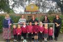 Broadway Infant School headteacher Jodie Tumelty with staff and pupils celebrating a good Ofsted rating