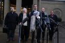 Solicitor Aamer Anwar, beside mother Margaret Caldwell and other family members (Andrew Milligan/PA)