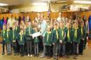 The cubs present the cheque to mayor of Thornbury Helen Harrison