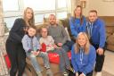 Bailey Griffiths,11, with her mum Laura, brother Max,6, and dad Nick after they received £1300 from Dursley Running Club members Margaret Johnson, Karen Eadon and Dave Durden.