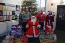 Santa with his helpers Mark Thompson and Stefan Demici from Pilgrim's UK and Denise Beddow