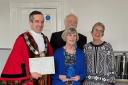 Judith Hurford holding her honour with Thornbury mayor James Murray, Chris Hurford and Cllr Helen Harrison