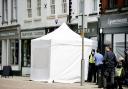 Police and forensic tents have been set up around a cafe in Gloucester where police are searching for a suspected victim of Fred West