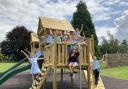 Children enjoying new play equipment recently installed on the school's grounds