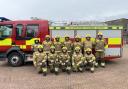 New firefighter Leech (first on the left bottom row) and firefighter Tyrrell (second on the left) with graduates from Avon Fire & Rescue Service