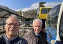 Dr Simon Opher with David Smith, secretary of Cam and Dursley Transportation Group, at Dursley bus station