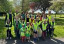 The Kingswood litter pick group dressed in high-vis and armed with litter pickers