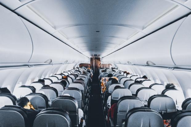 Gazette Series: Rows of empty seats on a plane. Credit: Canva