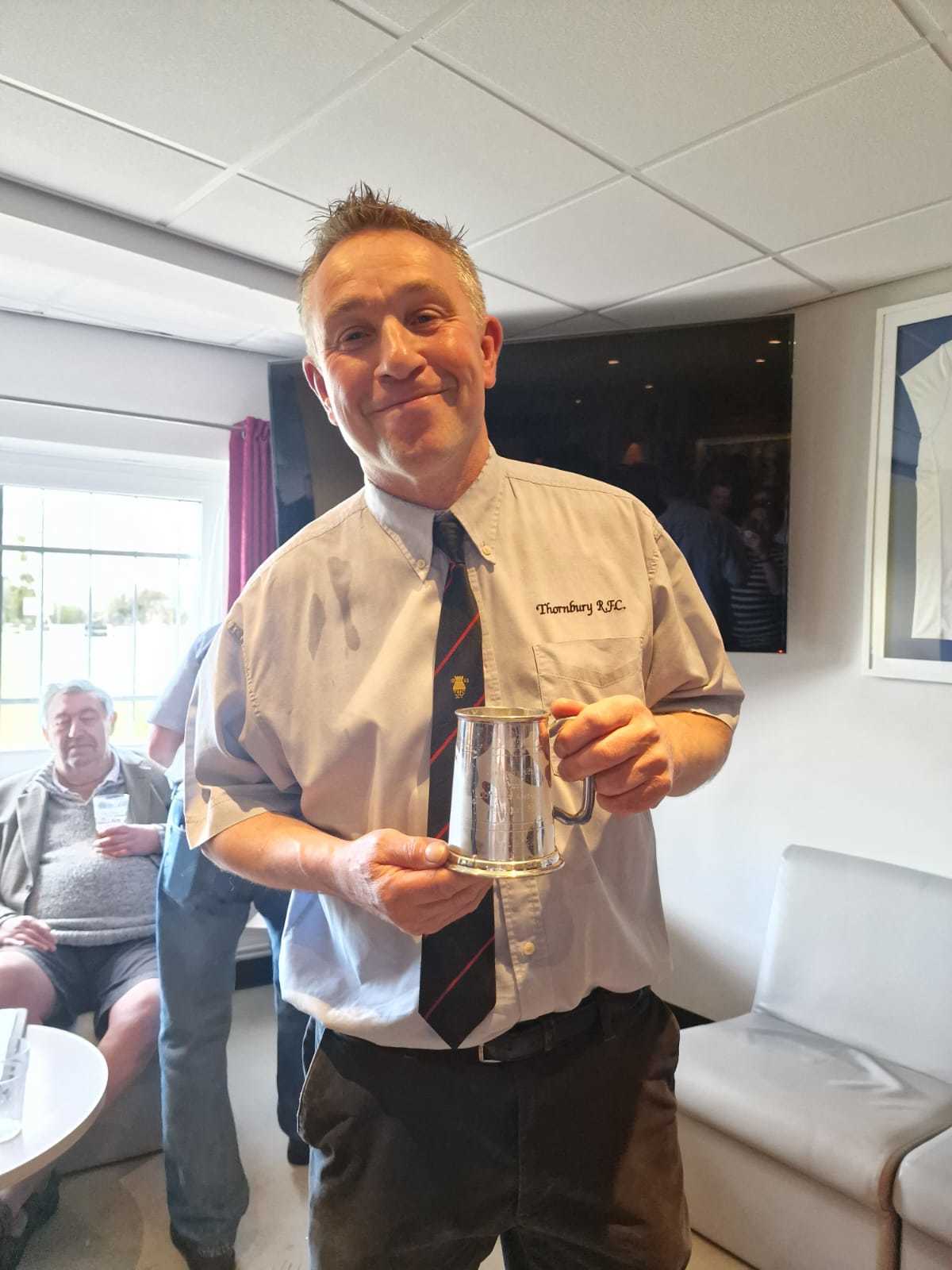 of Jon Pullin with the tankard presented to him on having played 600 senior games for the club