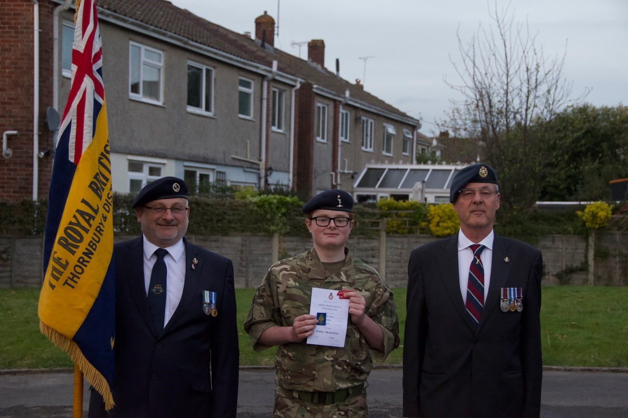 Cadet Hawkins with his Certificate and badges, with Mr MIck Mills and RBL Chairman Larry Cauchi