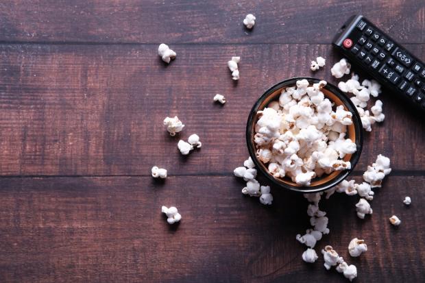 Gazette Series: A bowl of popcorn and a TV remote (Canva)