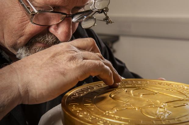 Gazette Series: Master craftsman Steve Dyer works on the 15 kilo gold coin by hand. Credit: The Royal Mint