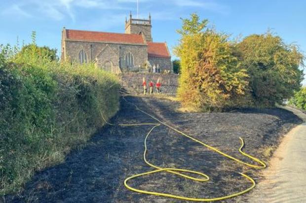 Firefighters with help from residents and local farmers tackled the blaze
