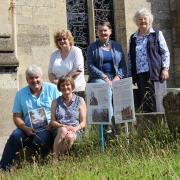 Julie Mountain (front) with members of the Remembering Rodborough team in Rodborough Churchyard