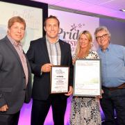 Richard Lewis, Sandra Lewis and Andrew Low of Peak Academy after receiving their award