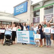 Luke Hall with local parents who campaigned for free swimming