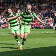 Forest Green Rovers Christian Doidge(9) scores a goal 0-1 and celebrates during the EFL Sky Bet League 2 match between Cheltenham Town and Forest Green Rovers at LCI Rail Stadium, Cheltenham, England on 14 April 2018. Picture by Shane Healey.