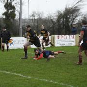 Mike Gaston cutting through the Devonport Services defence to score