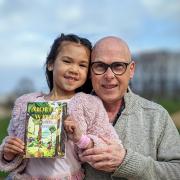 Michael Hamill with his daughter Molly aged eight and his children’s book Molly’s Wings 