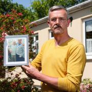 Leigh Blanning with a photo of his father John who died at the age of 82 last year in December
