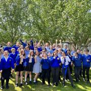 Pupils from Blue Coat Primary celebrating their school's recent Ofsted result