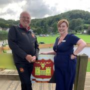 Dursley Rugby Club chairman Phil Sprague with Slimming World group consultant Ruth Voller