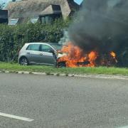 A vehicle was engulfed by flames along the A38 at Alveston on Sunday afternoon - picture by Izzy Oakey