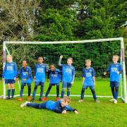 Players from the under-10s Slimbridge Cygnets YFC celebrating their recent win