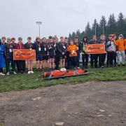 Teenagers from Dursley Rugby Club as they walk from Stroud to Dursley during a challenge inspired by their former coach