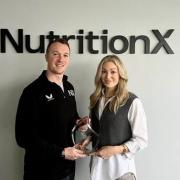 Nutrition X co-directors James Markey and Naomi Christiansen celebrate the recent award win