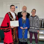 Judith Hurford holding her honour with Thornbury mayor James Murray, Chris Hurford and Cllr Helen Harrison