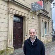 Luke Hall MP standing outside the old NatWest bank building in Thornbury