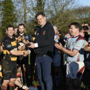 Thornbury captain Stuart Adams presented with the Rob Tillen Decadence Cup, a trophy to be played for annually by the veteran players of Thornbury and Chiswick