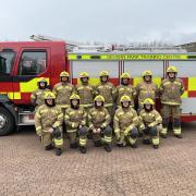 New firefighter Leech (first on the left bottom row) and firefighter Tyrrell (second on the left) with graduates from Avon Fire & Rescue Service